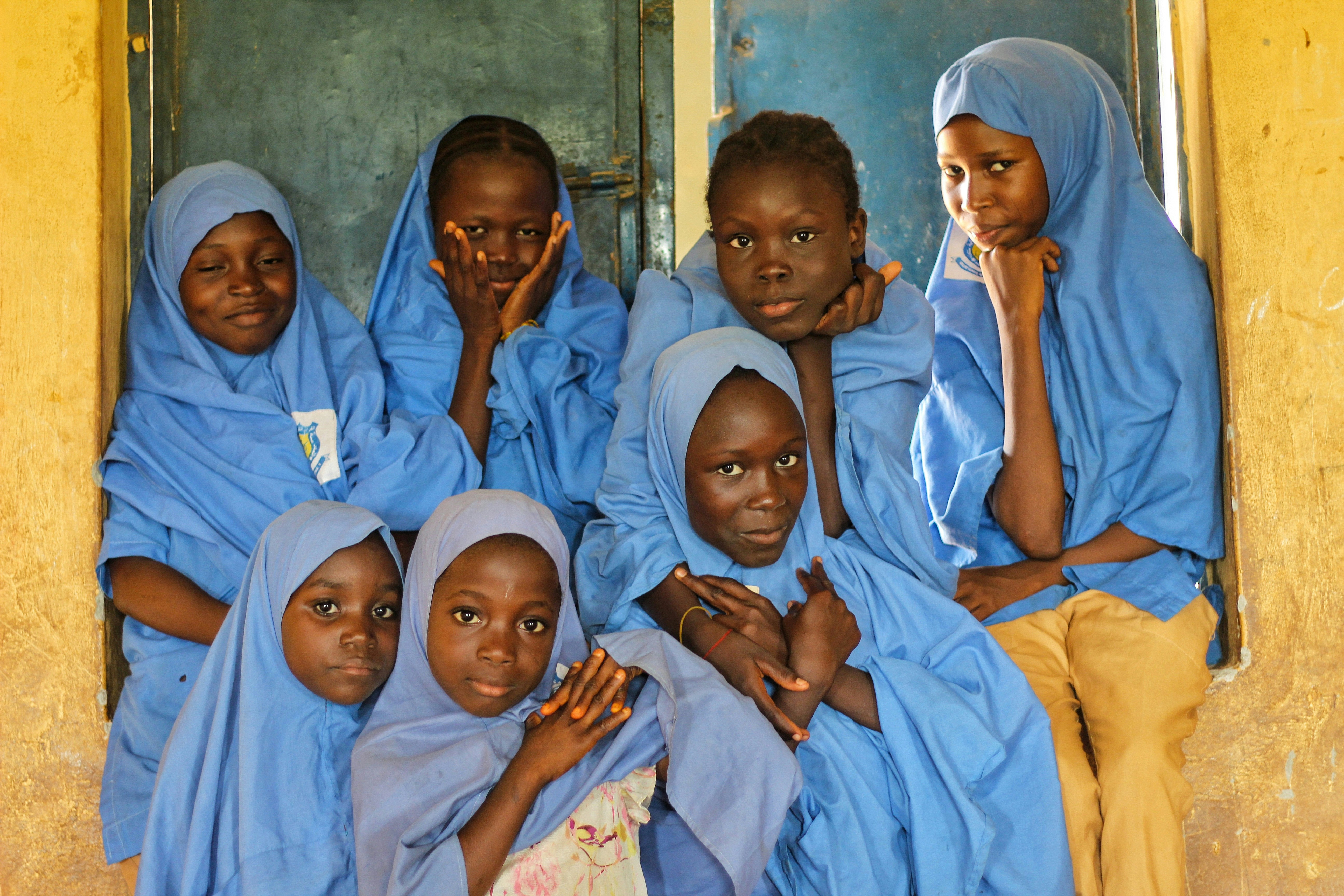 Schoolgirls gathered together.